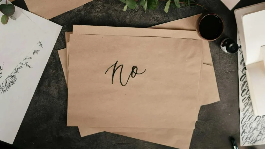 The word No, written boldly on a brown paper