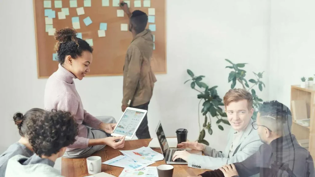 A group of employees sharing ideas on a round table