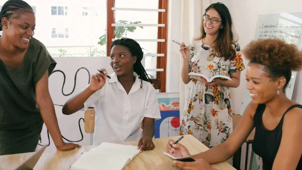Self-awareness is the cornerstone of emotional intelligence in the workplace—four ladies discussing on a round table