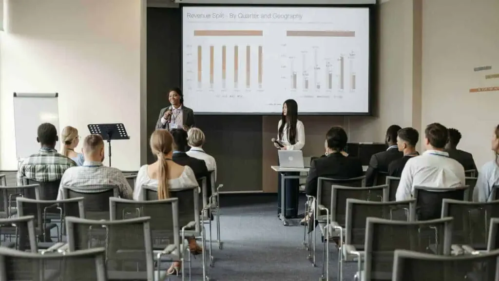A group of employees in a seminar room