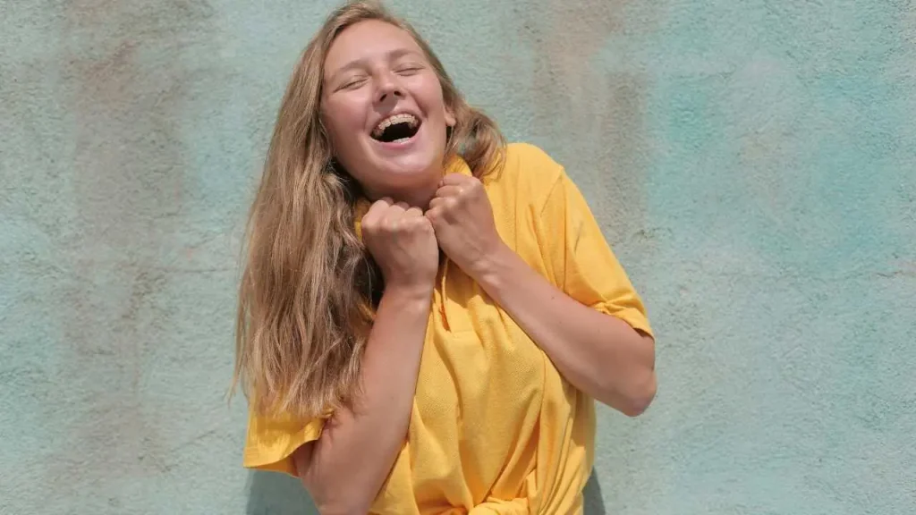 A jolly lady in yellow shirt