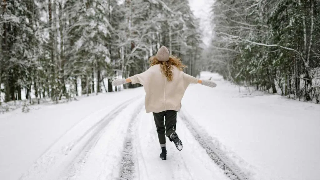 A lady running in the snow representing how to get back on track