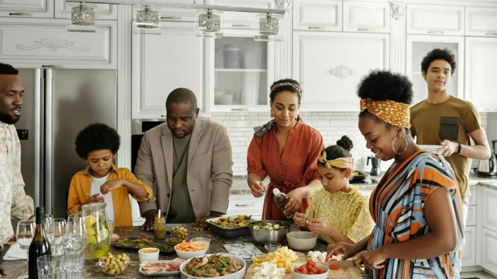 Social connection as a stress management techniques. Family making breakfast together in the kitchen