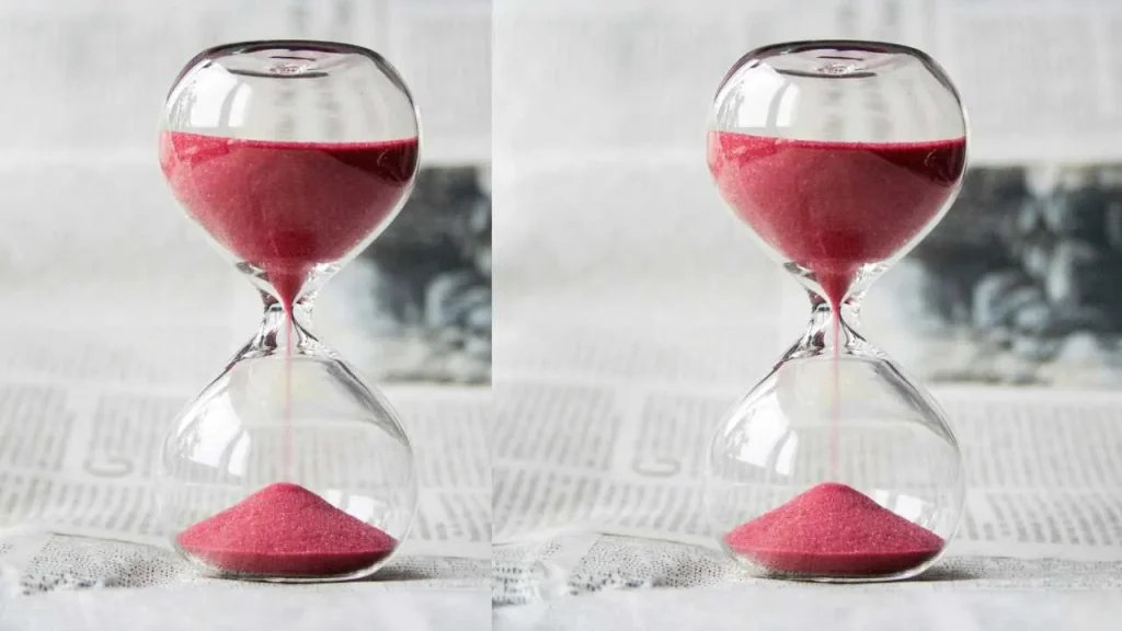 An hour glass containing red susbtance showcasing the origin of the 5-hour rule