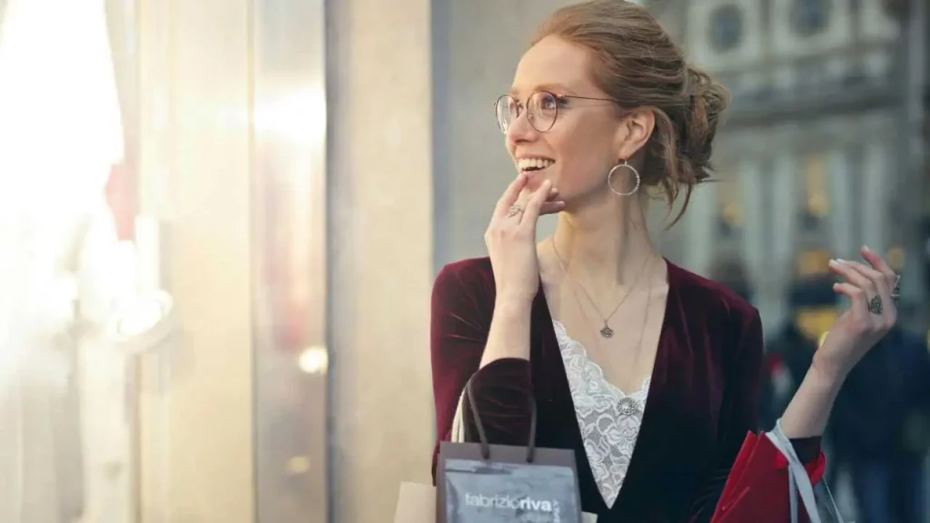 A lady with hands full with shopping bags