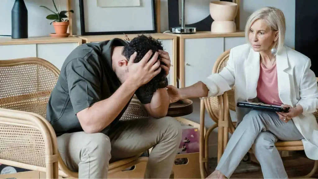 A young man in a therapy class