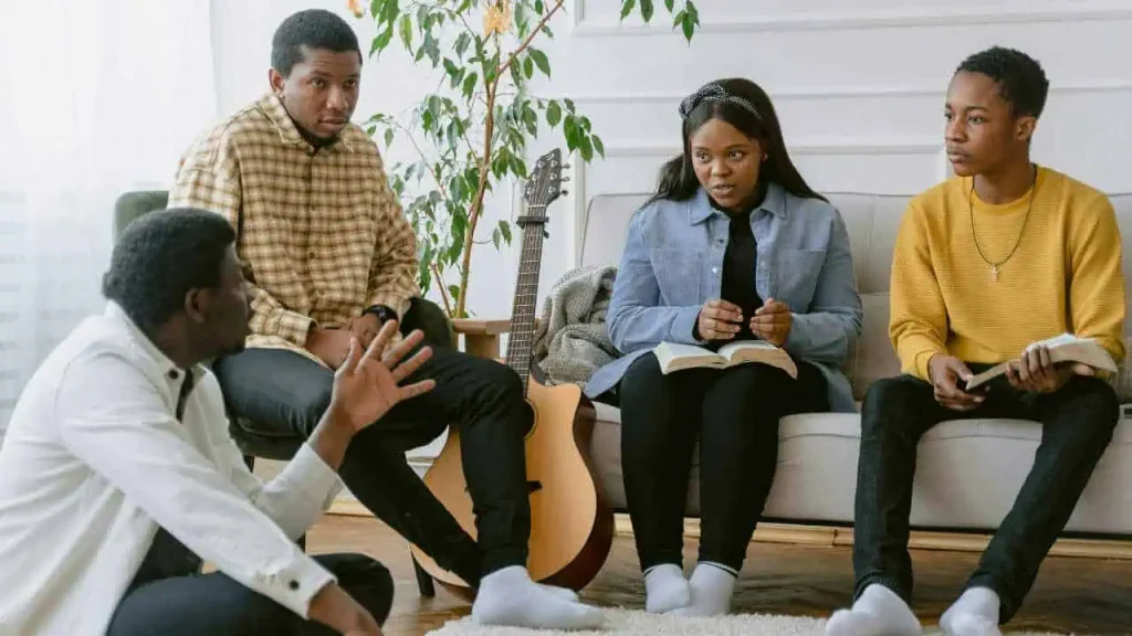 A group of friends having a conversation representing how to overcome childhood emotional neglect