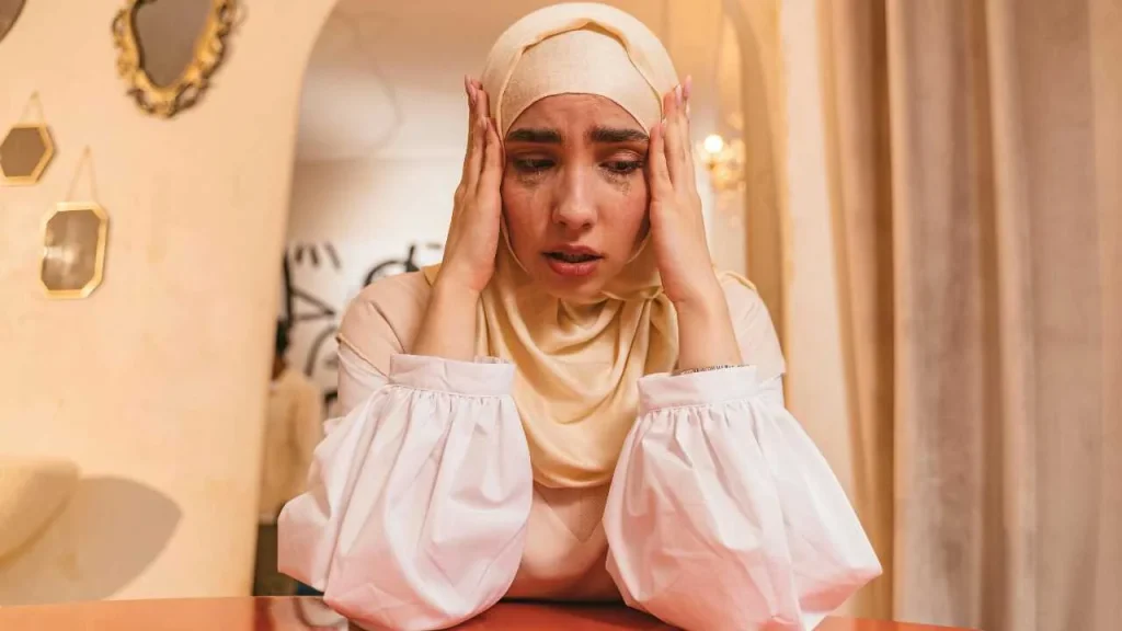 A sad lady crying depicting how failure leads to insecure feelings
