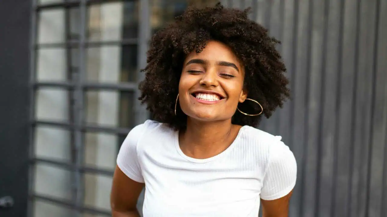 1742689771363 A lady smiling depicting how to cultivate self acceptance