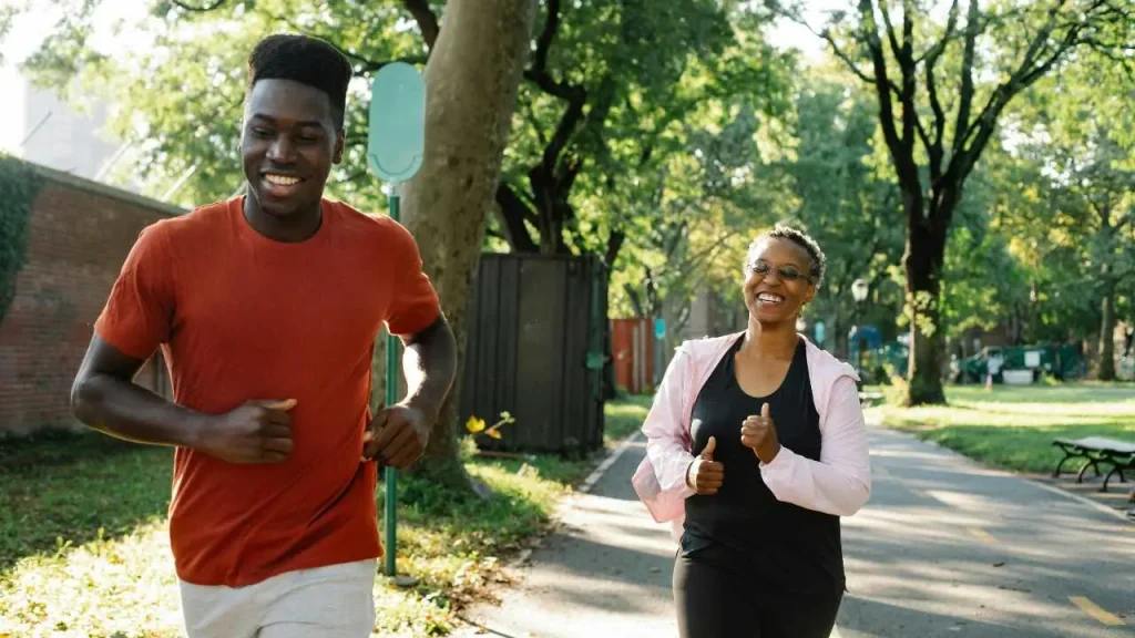 A man and a woman jogging depicting how waking up early can change your life