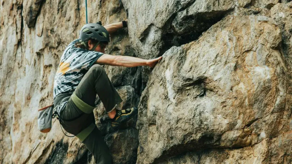 A man climbing a rock