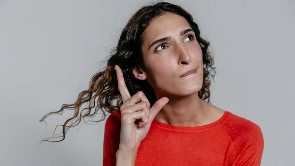 A woman on red thinking