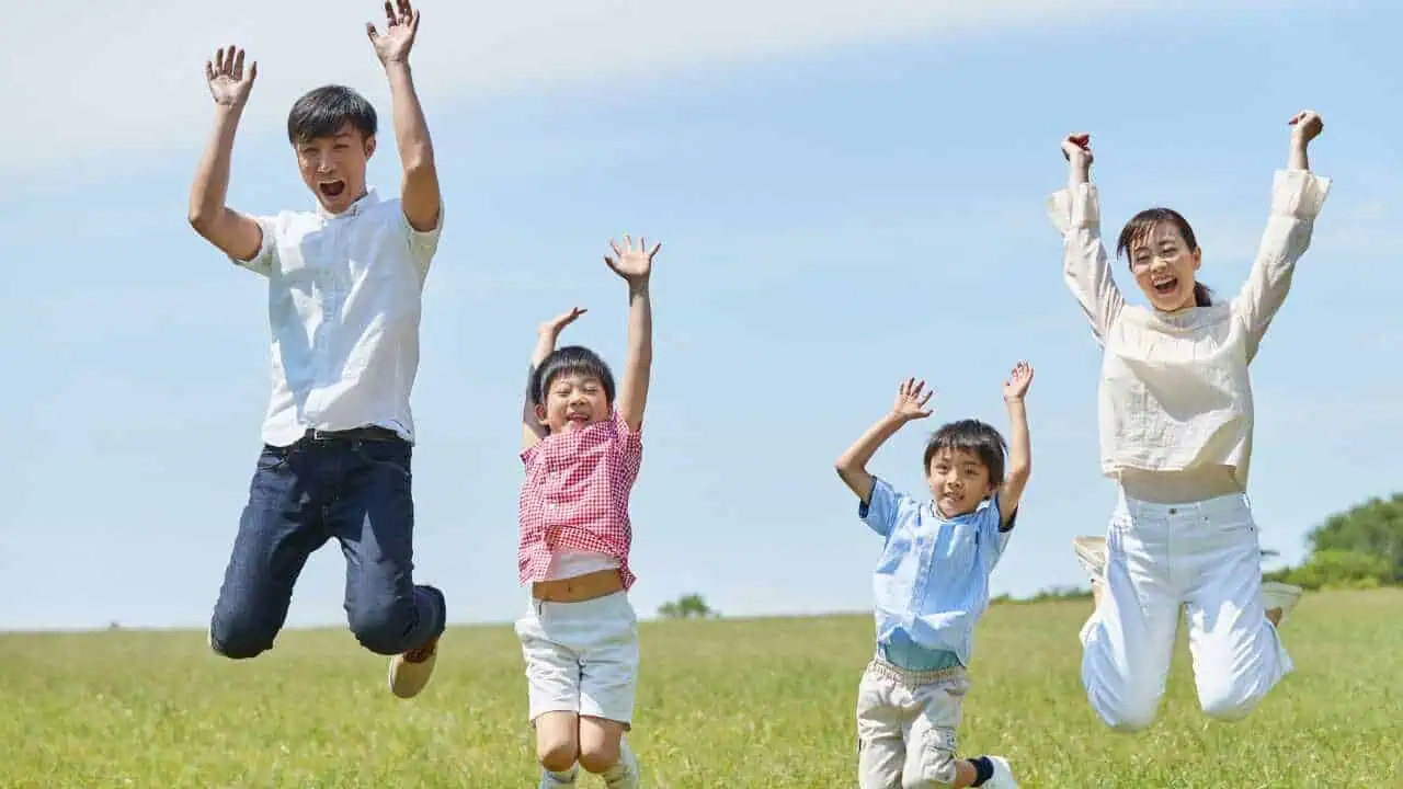 Joyful family depicting quotes on happiness and Joy