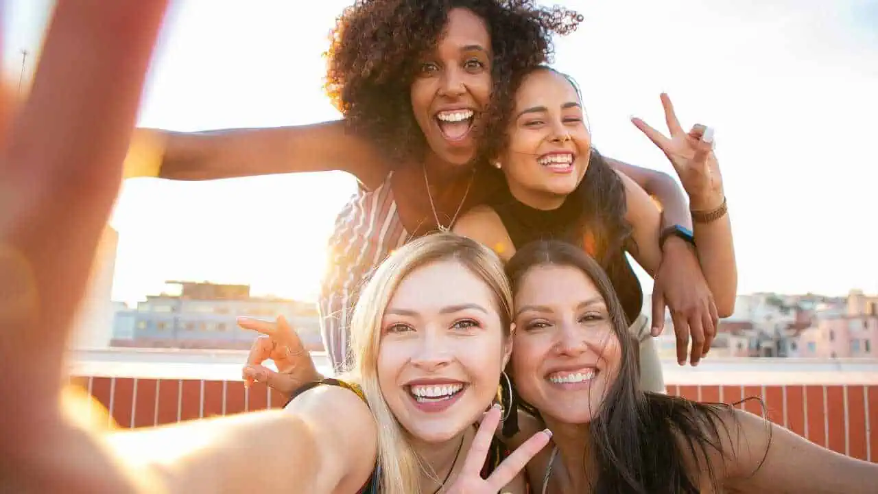 Happy and Smile Quotes A group of four ladies smiling depicting happy and smile quotes