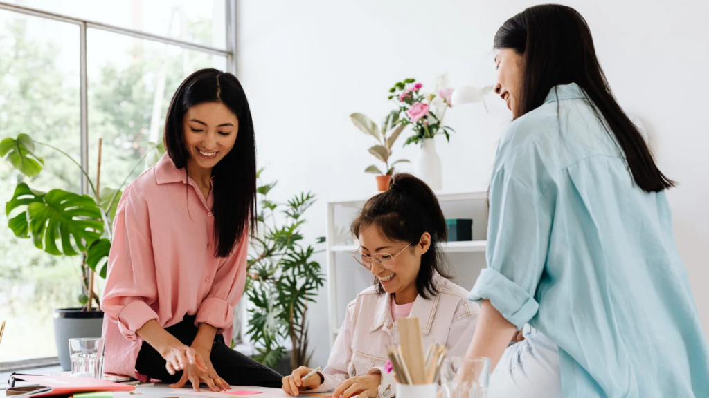 A group of 3 ladies interacting 